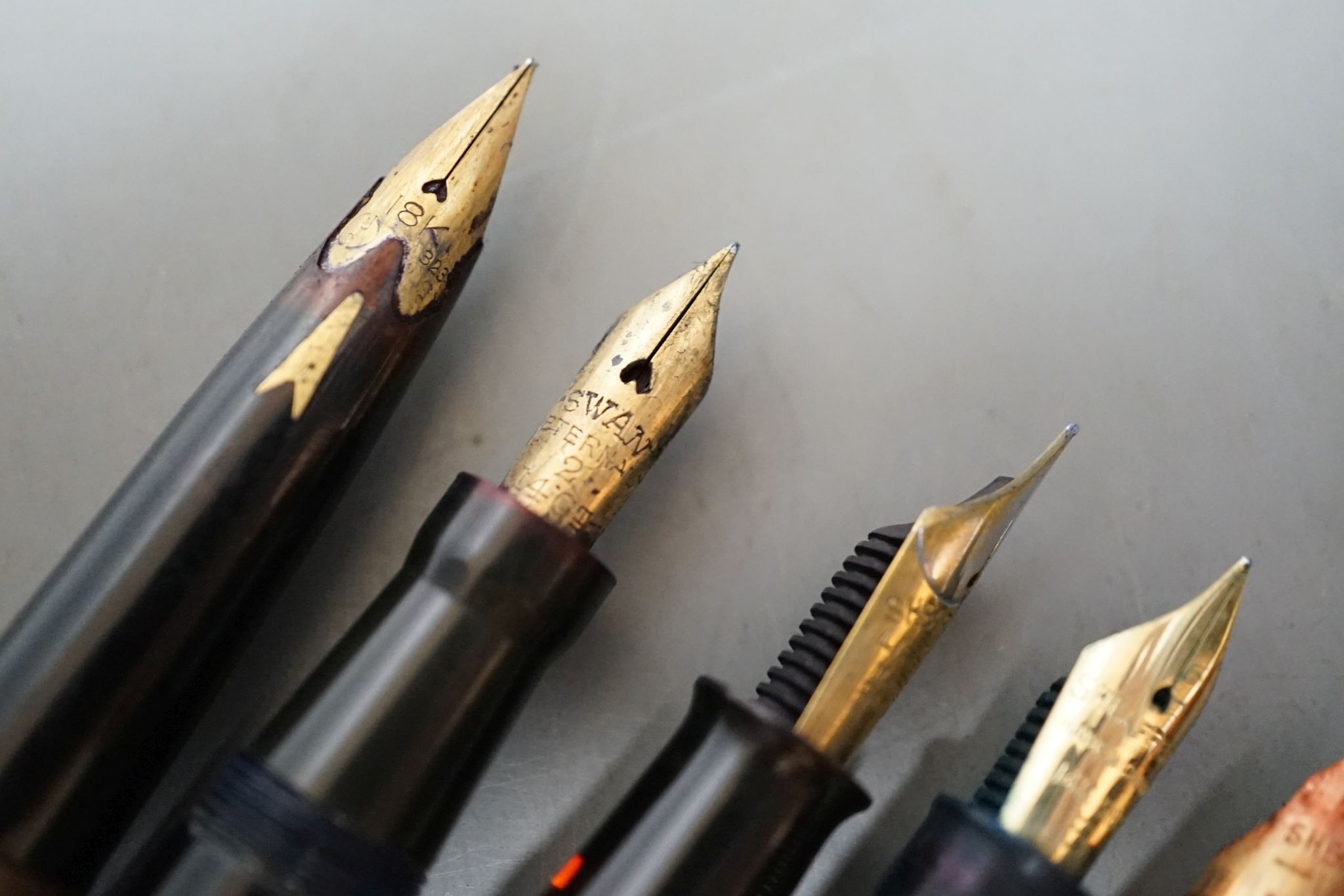 Seven assorted pens including fountain pen with 18ct gold nib.